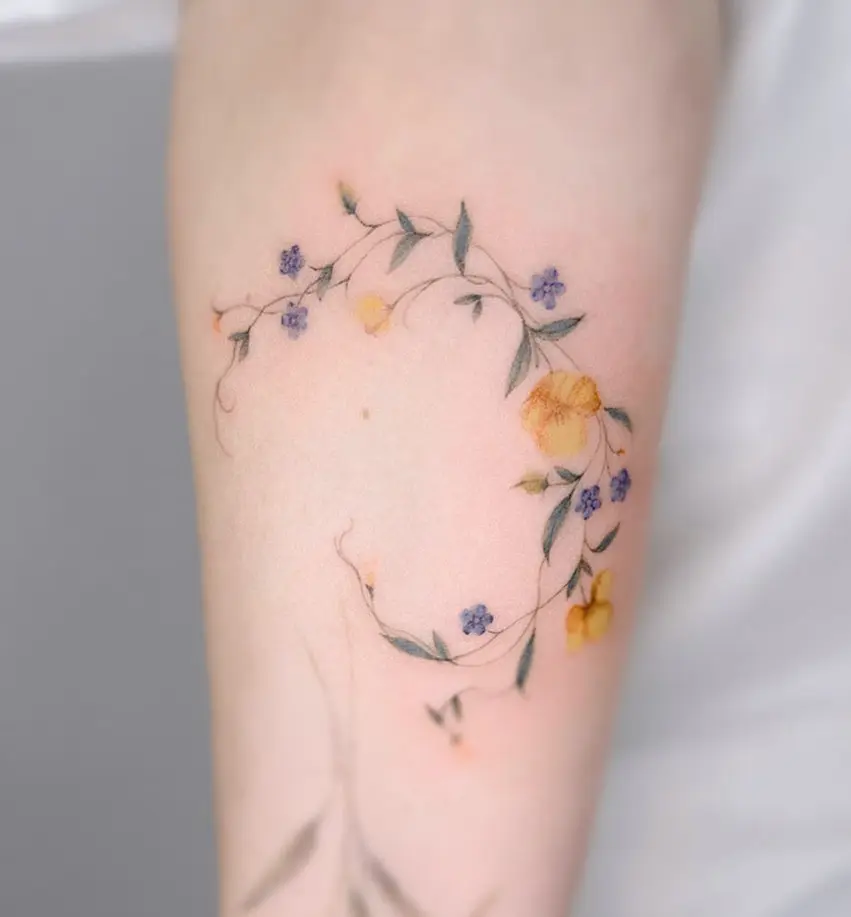 Graceful vine tattoos with delicate floral accents