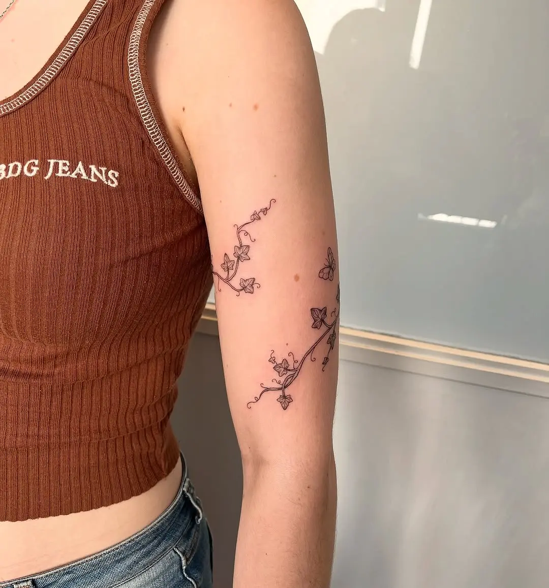 Elegant vine tattoo wrapping the arm