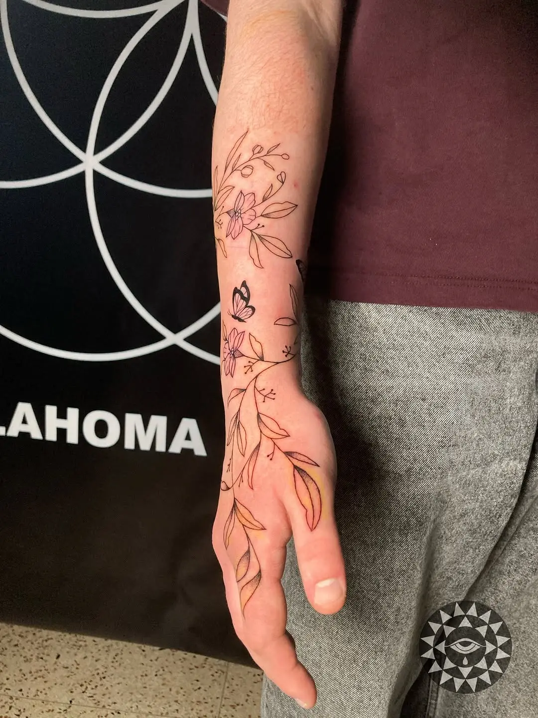 Elegant vine tattoo wrapping around the arm