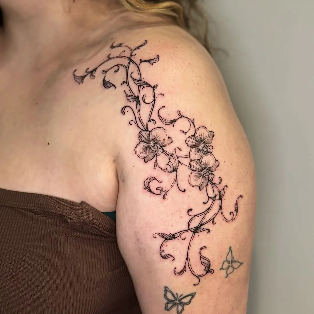 Elegant vine tattoos with intricate floral details