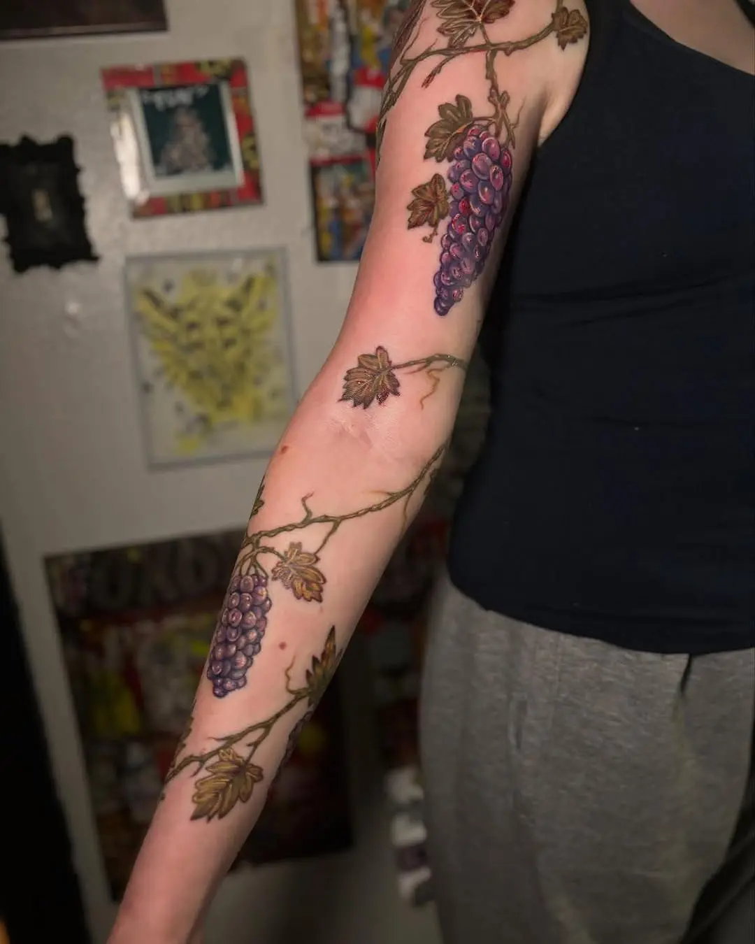 Elegant grape vine tattoo on a woman's arm