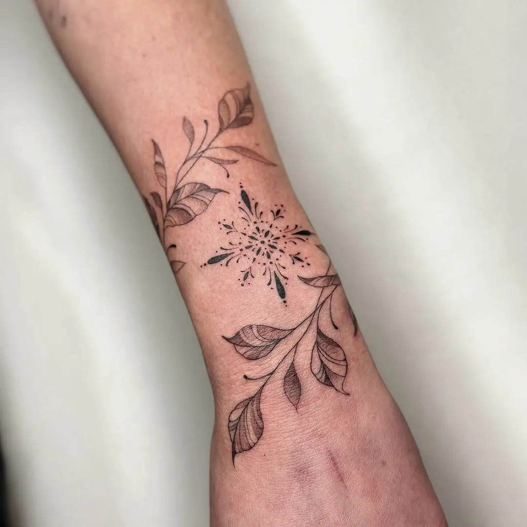 Elegant vine tattoo with leaf details