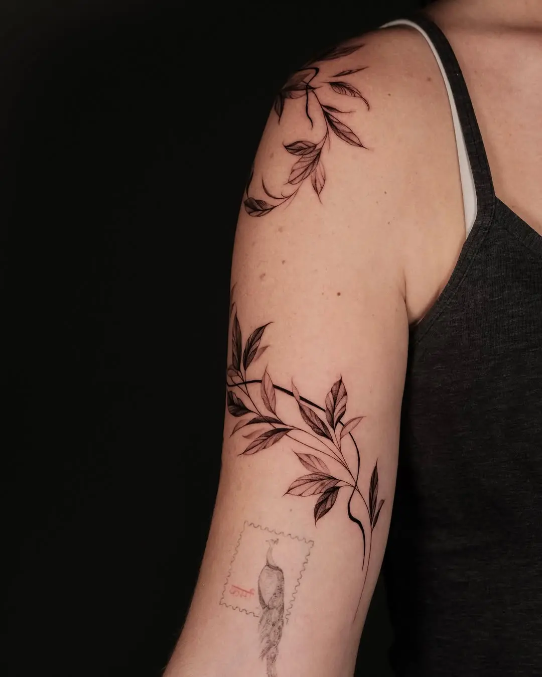 Elegant vine tattoos wrapping around the arm
