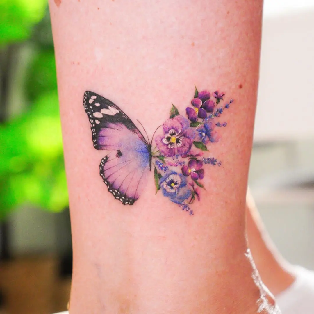 Stunning violet butterfly and floral tattoo design