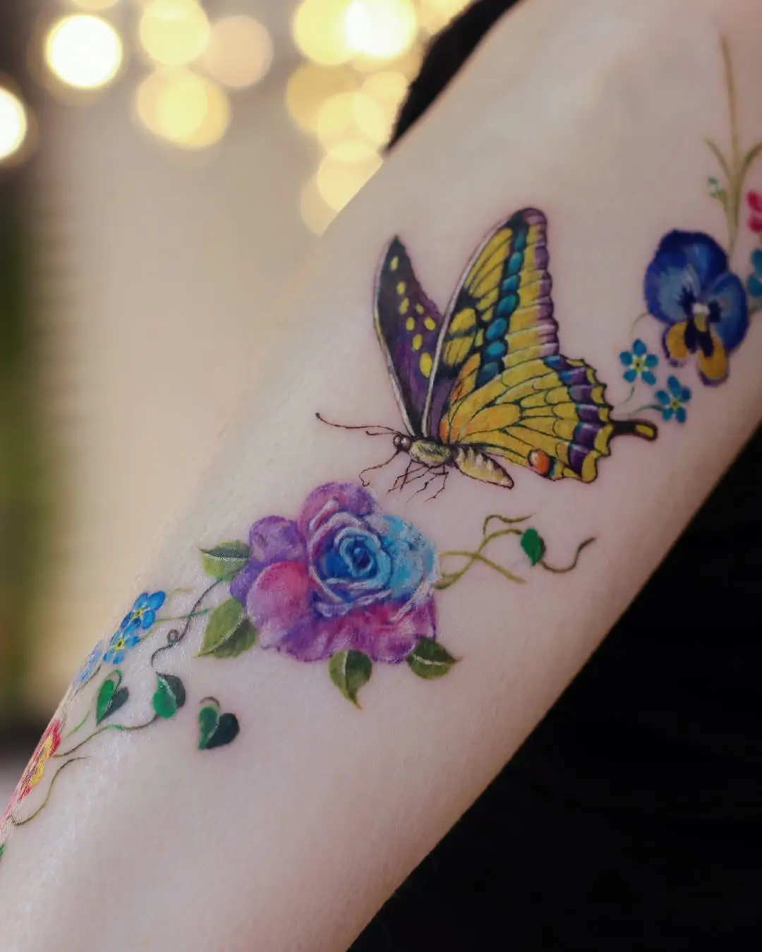 Vibrant violet butterfly and floral tattoo design