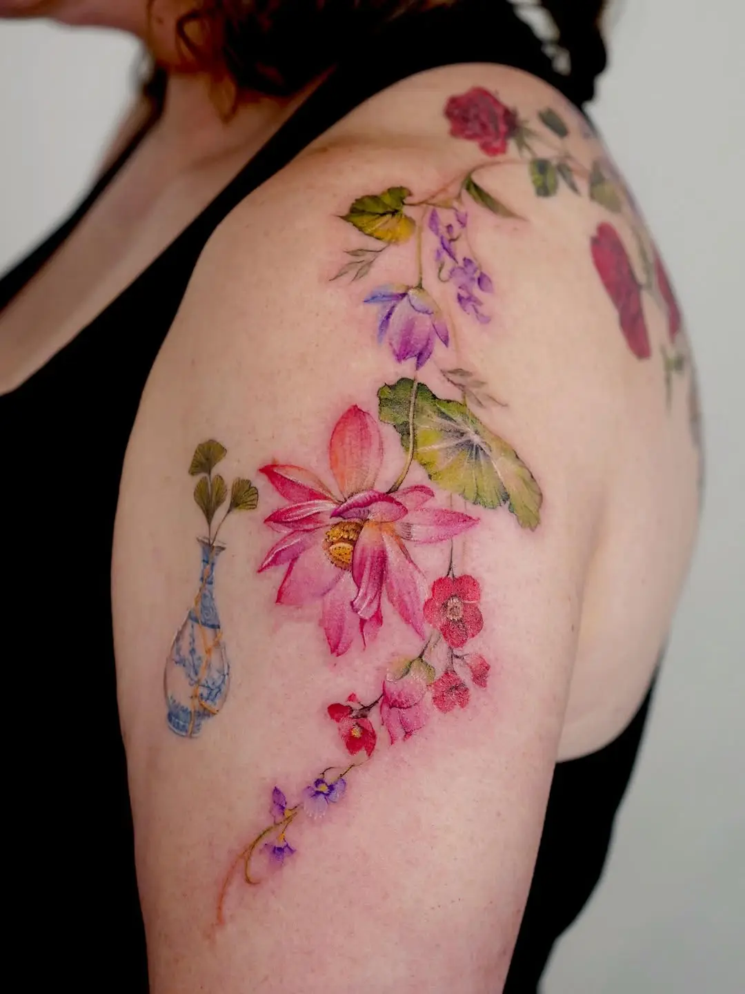 Stunning violet floral tattoo on shoulder