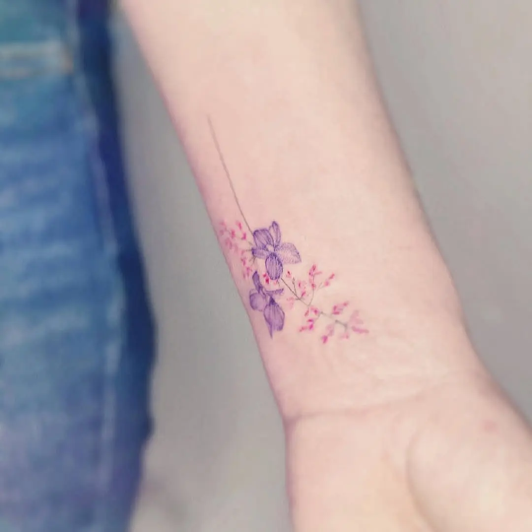Elegant violet floral tattoo perfect for minimalists