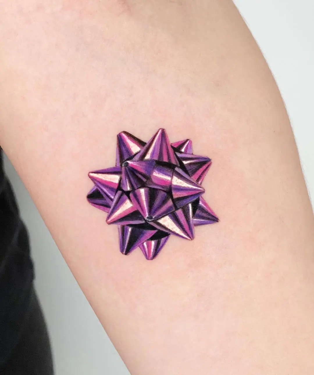 Stunning violet gift bow tattoo design