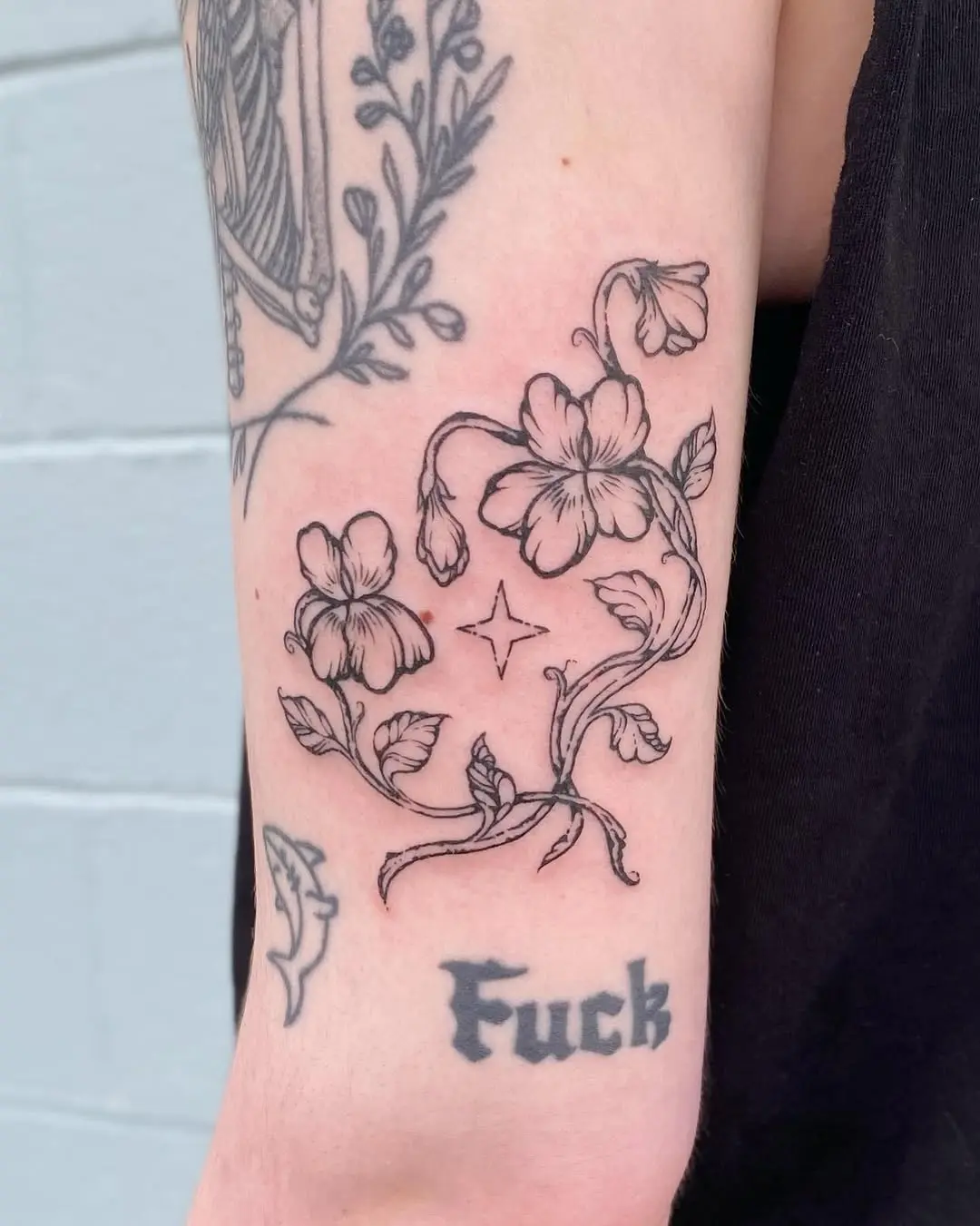 Elegant violet floral tattoo design with text