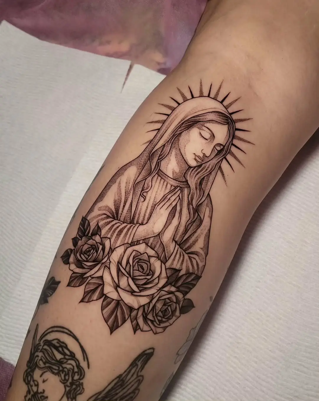 Elegant Virgin Mary Tattoo Surrounded by Roses
