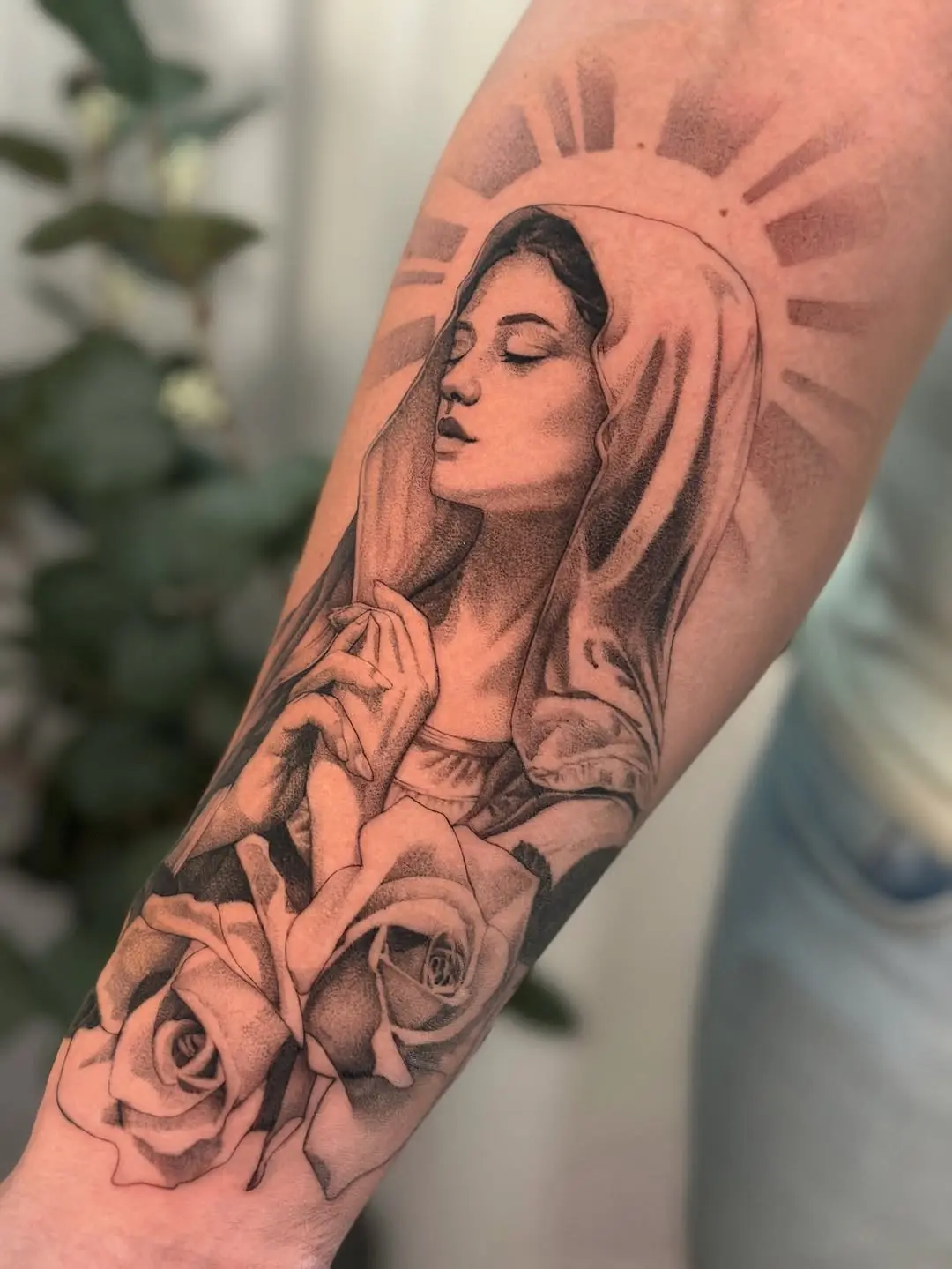 Elegant Virgin Mary Tattoo Surrounded by Roses