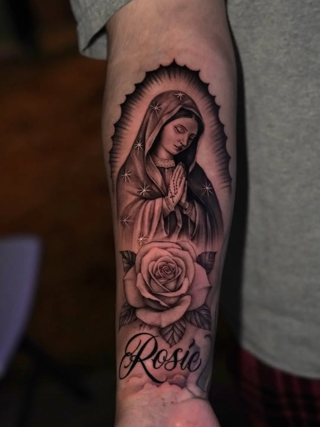 Elegant Virgin Mary tattoo with a rose motif