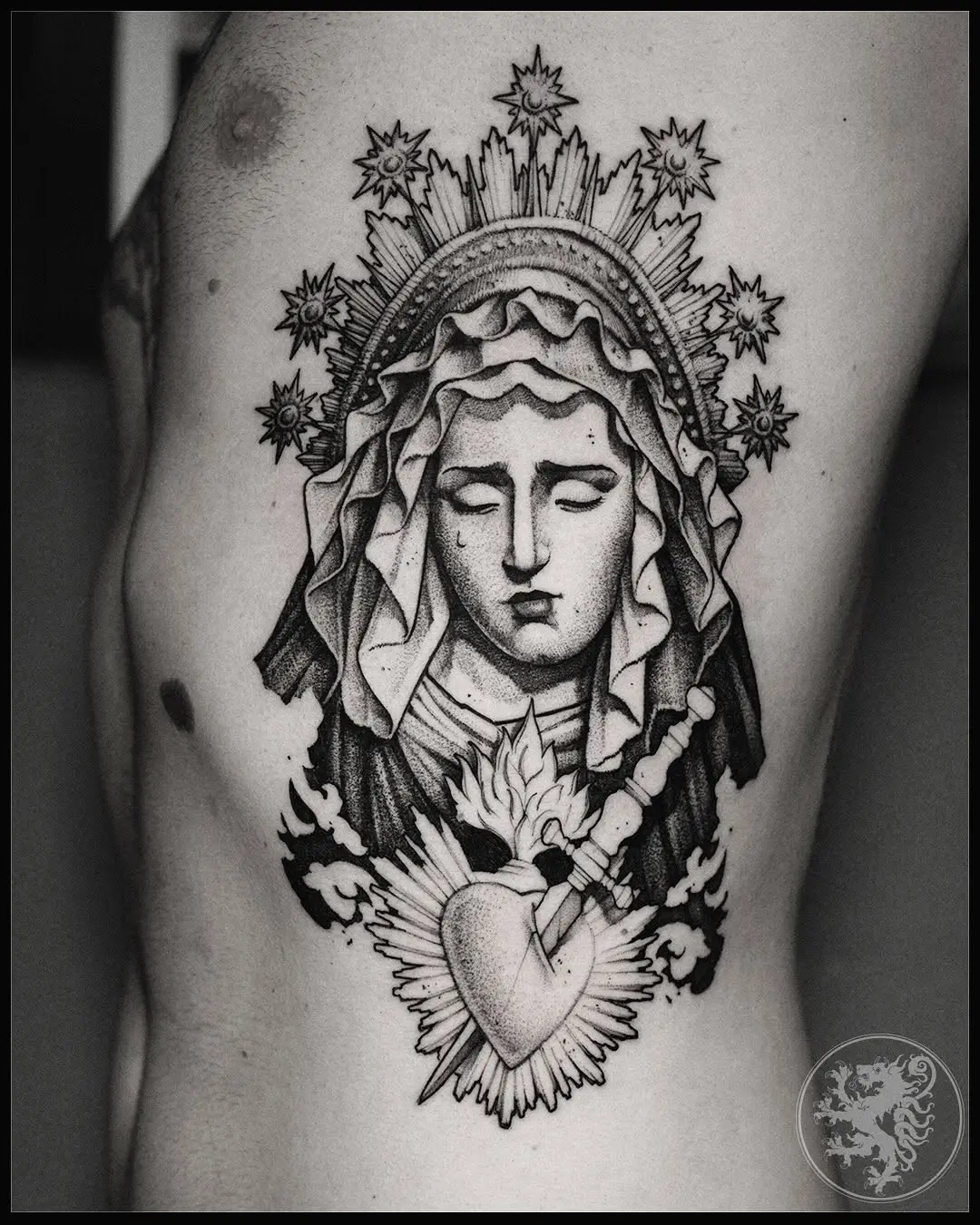 Stunning Virgin Mary tattoo with heart symbolism