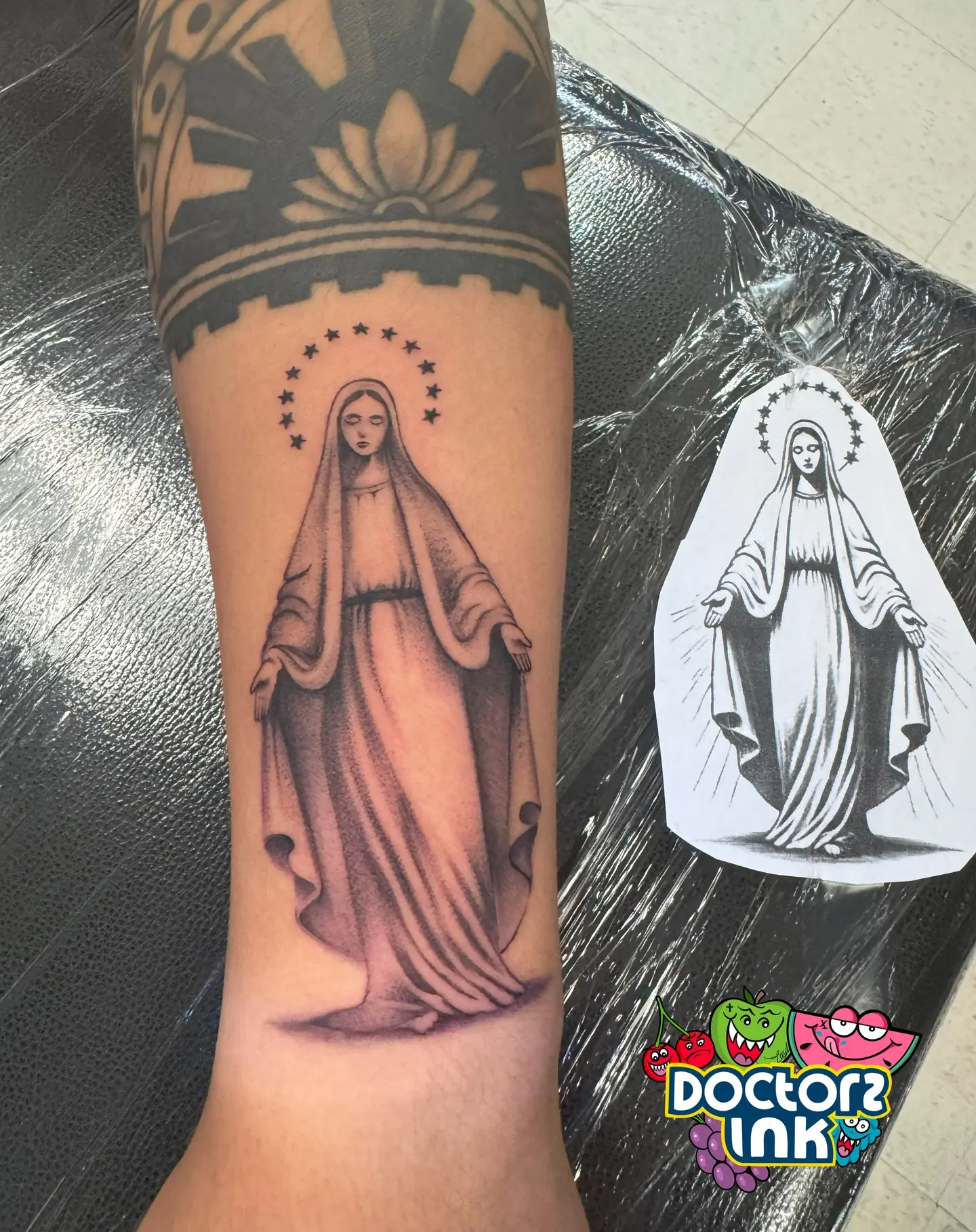Detailed Virgin Mary tattoo with graceful features