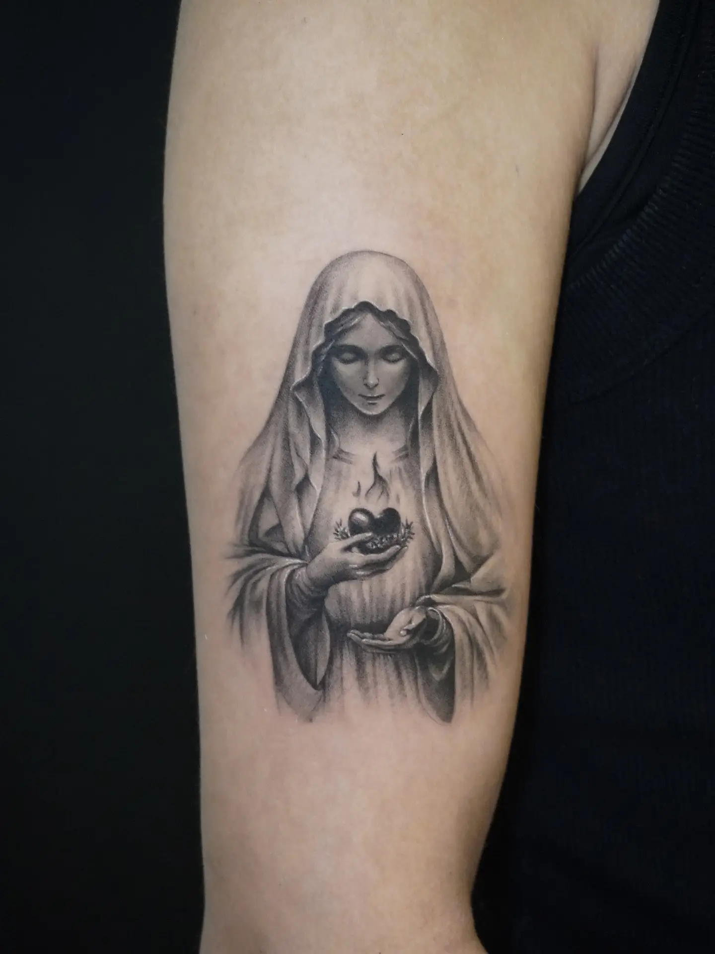 Intricate Virgin Mary Tattoo Holding a Heart