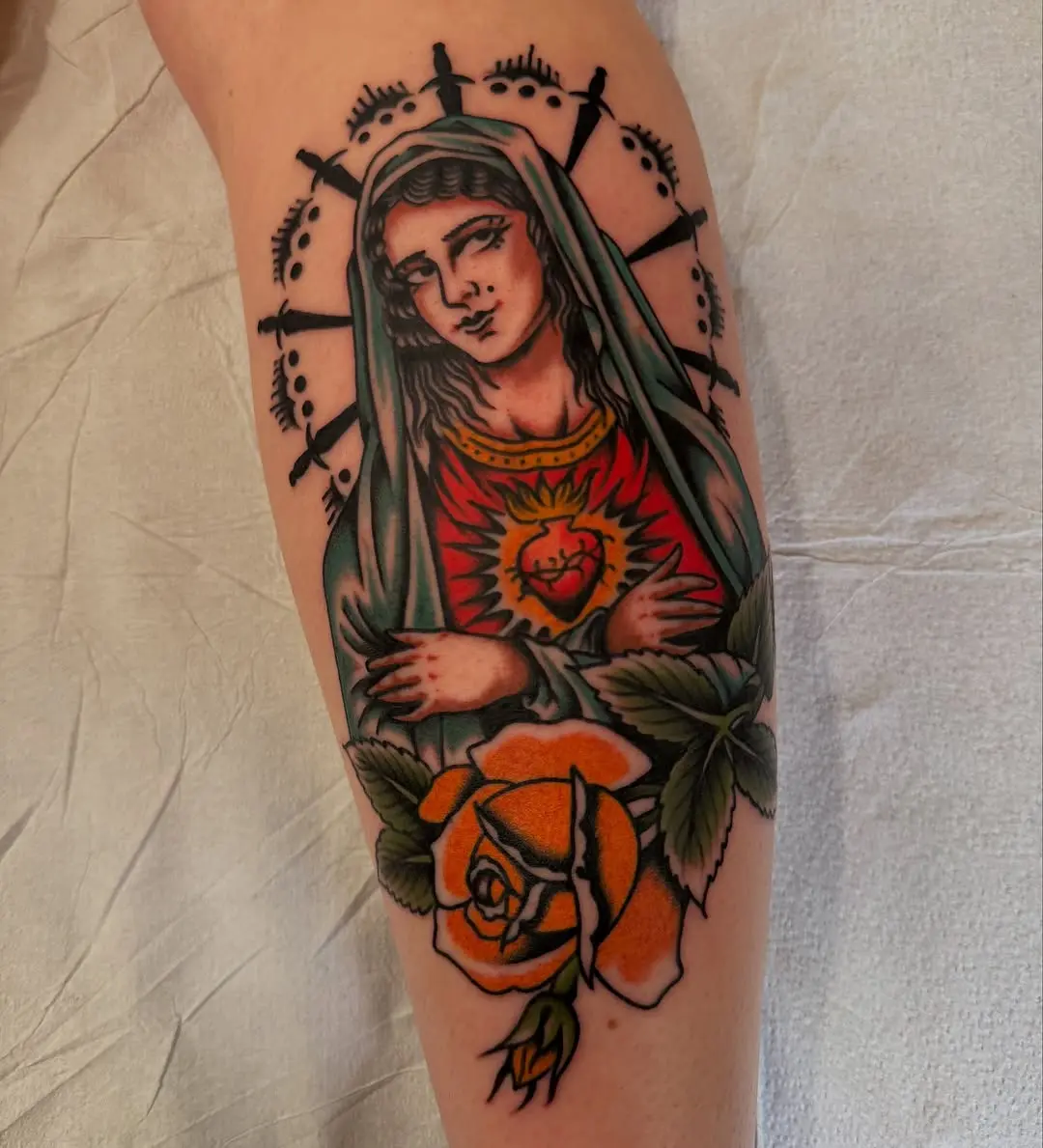 Intricate Virgin Mary Tattoo with Roses Detail