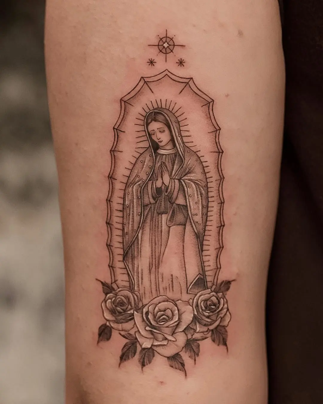 Elegant Virgin Mary Tattoo Surrounded by Roses