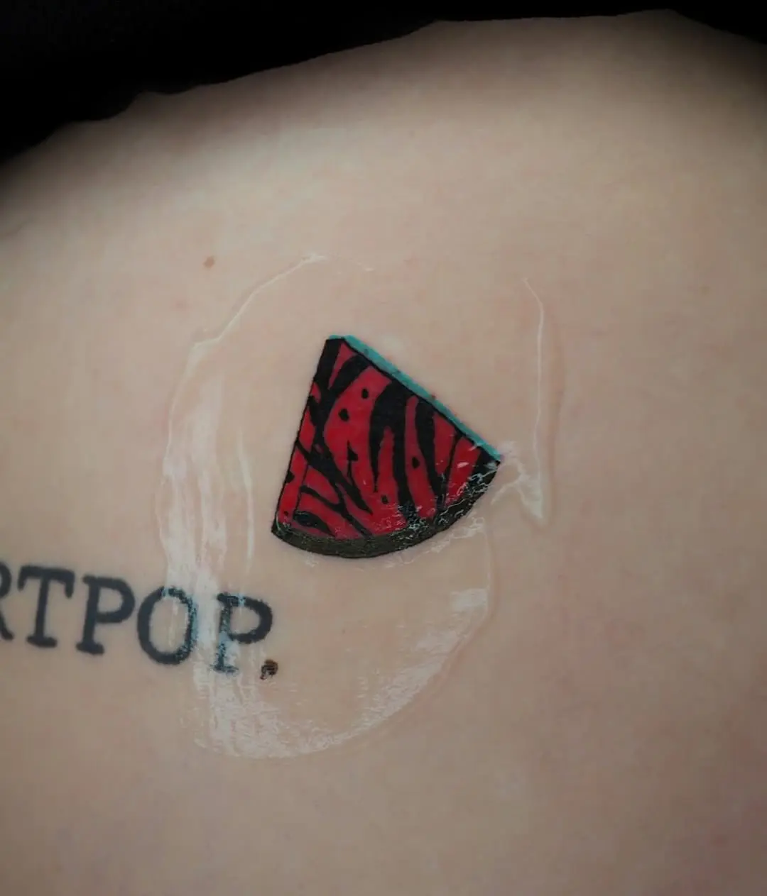 Vibrant watermelon tattoo with artistic flair