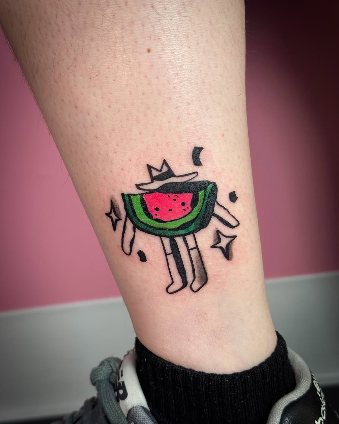 Playful Watermelon Tattoo with Character Vibes
