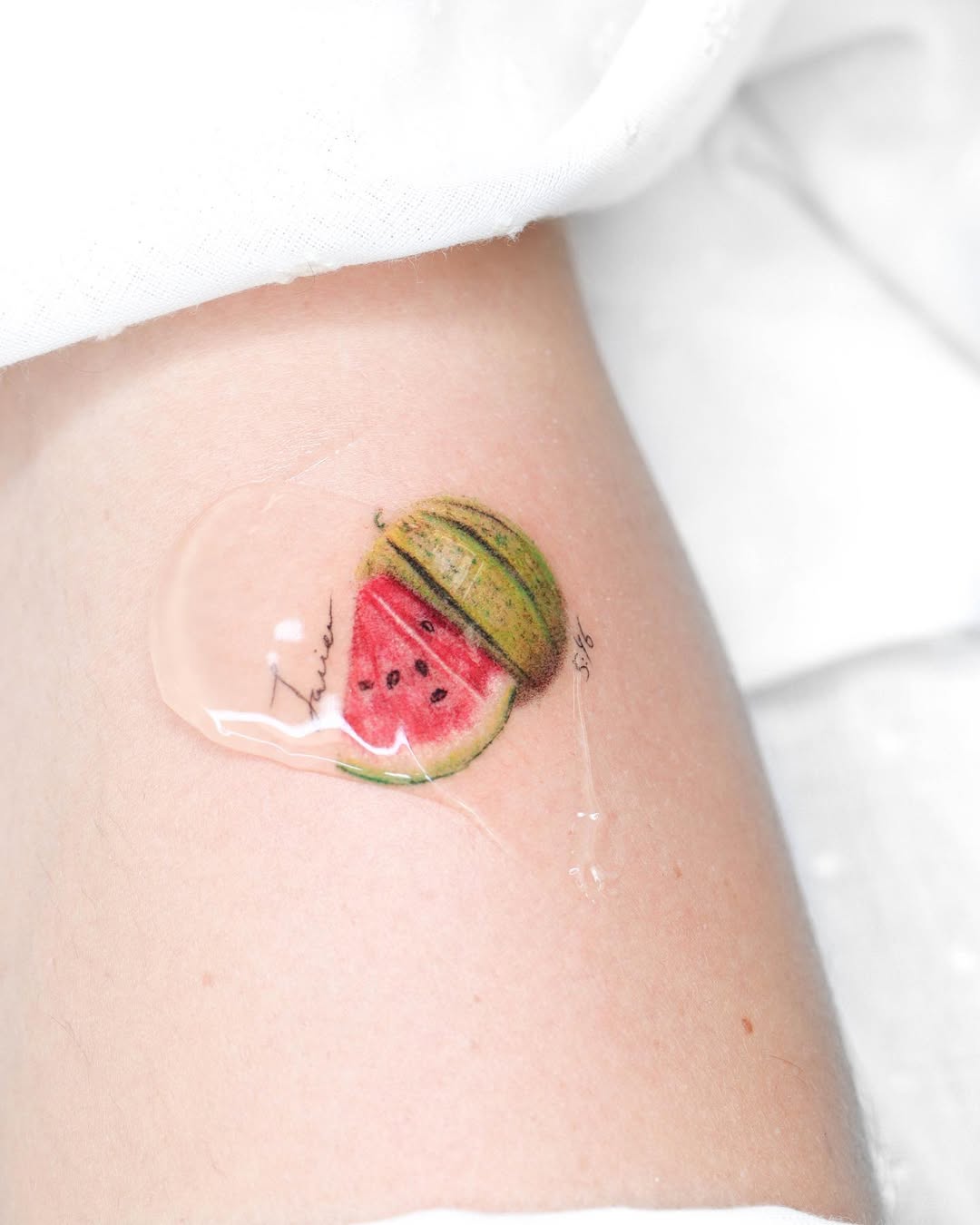 Vibrant and playful watermelon slice tattoo