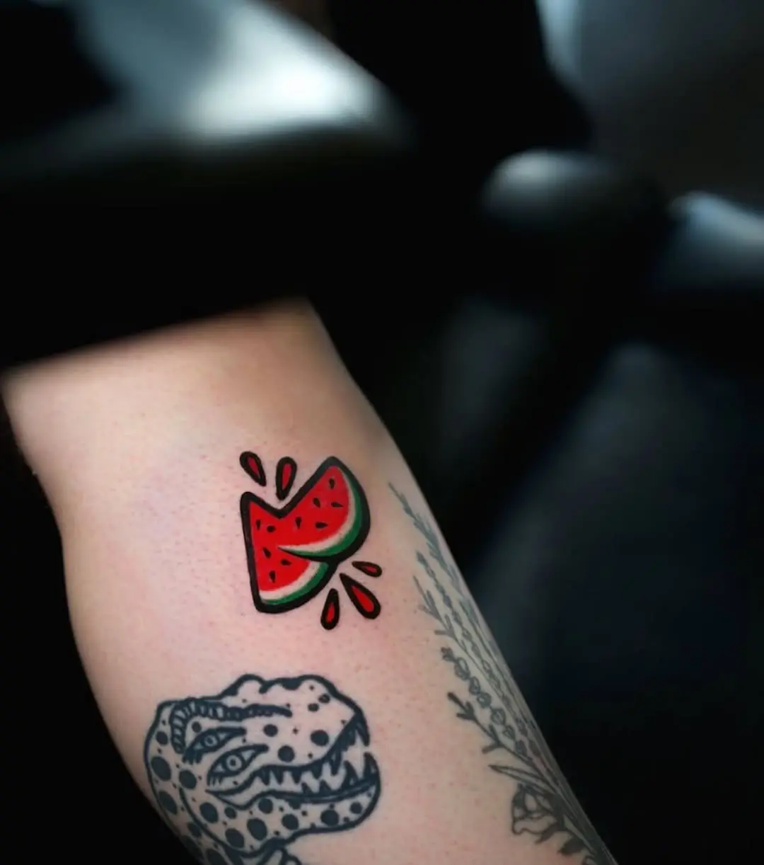 Vibrant watermelon tattoo radiating fun vibes