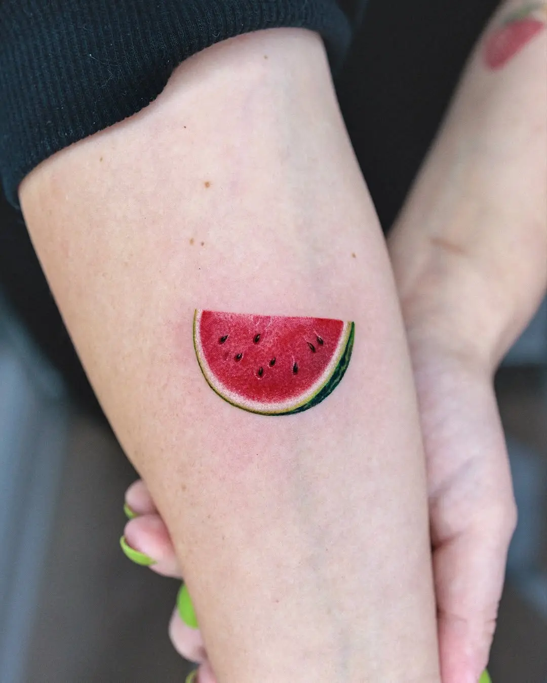 Vibrant Watermelon Slice Tattoo on Skin