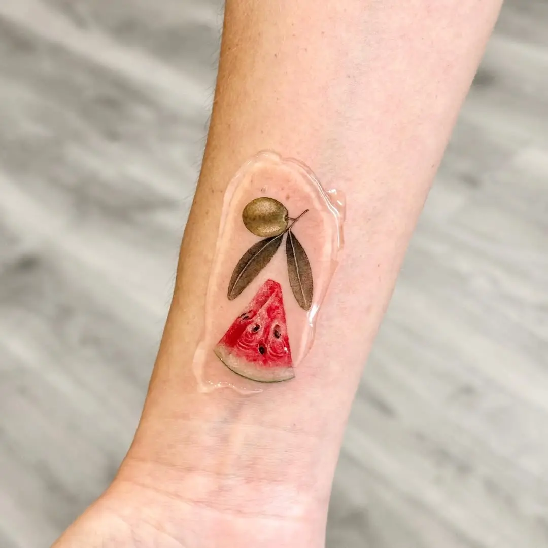 Vibrant watermelon slice with olive branch design