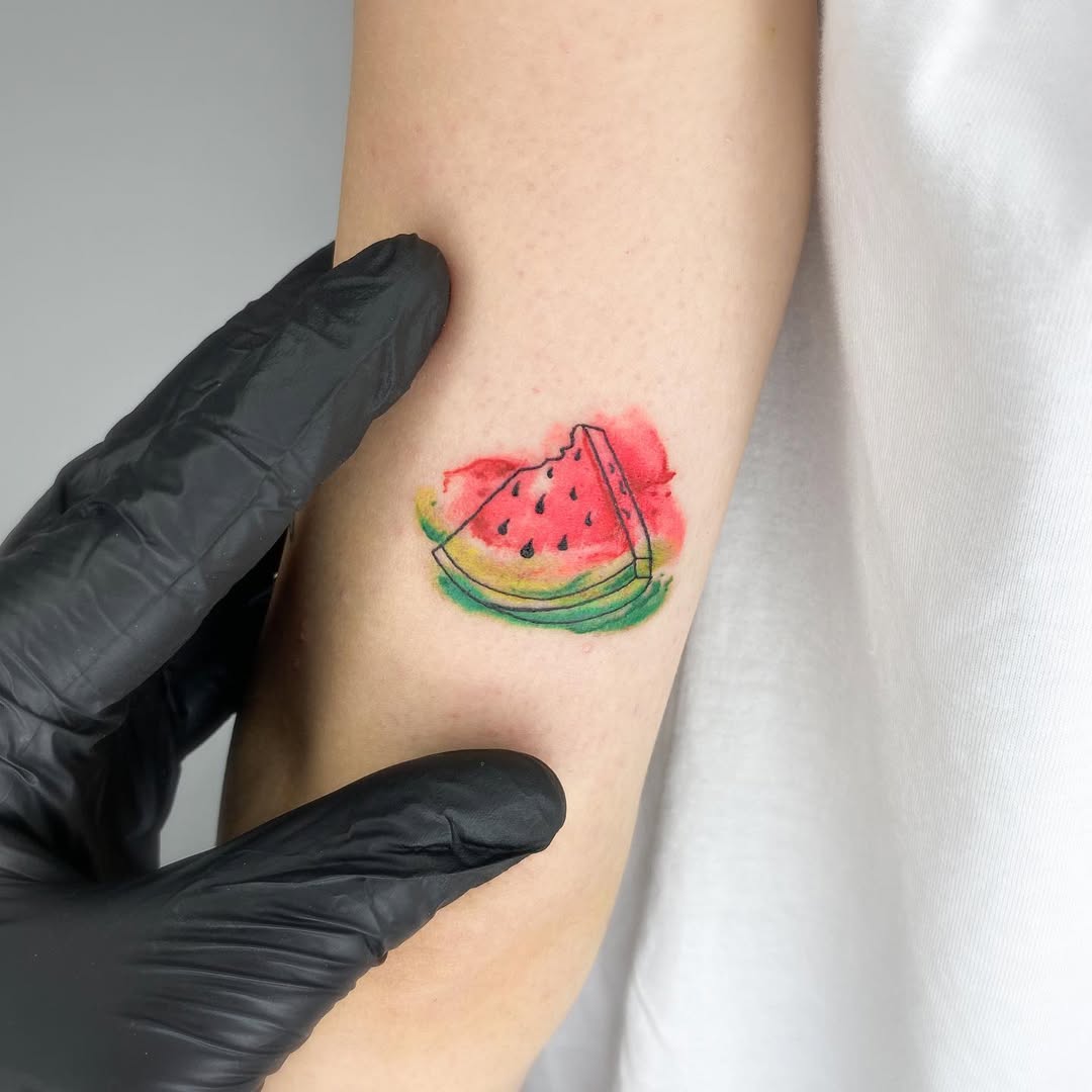 Vibrant watermelon tattoo with artistic flair