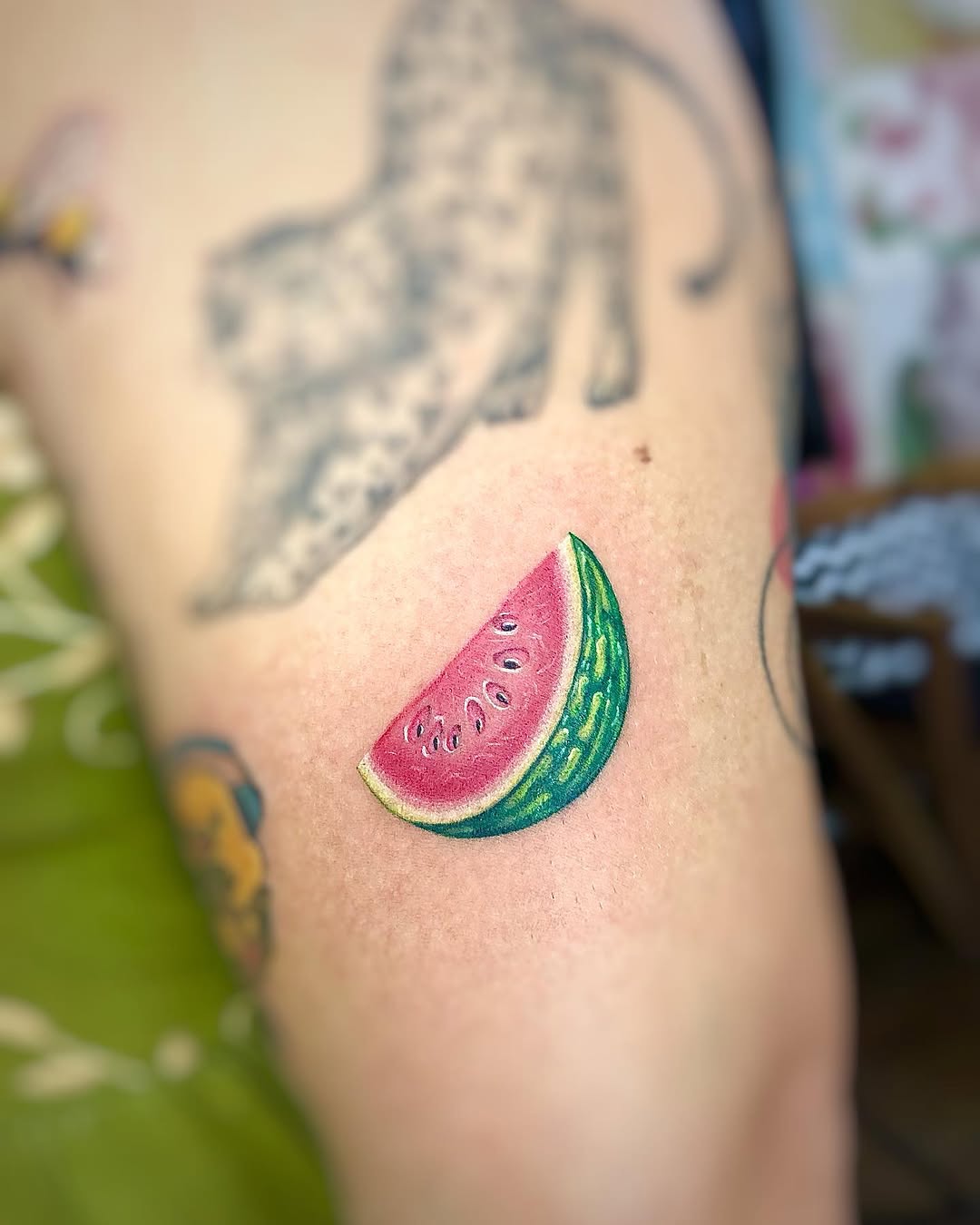 Vibrant Watermelon Slice Tattoo on Arm