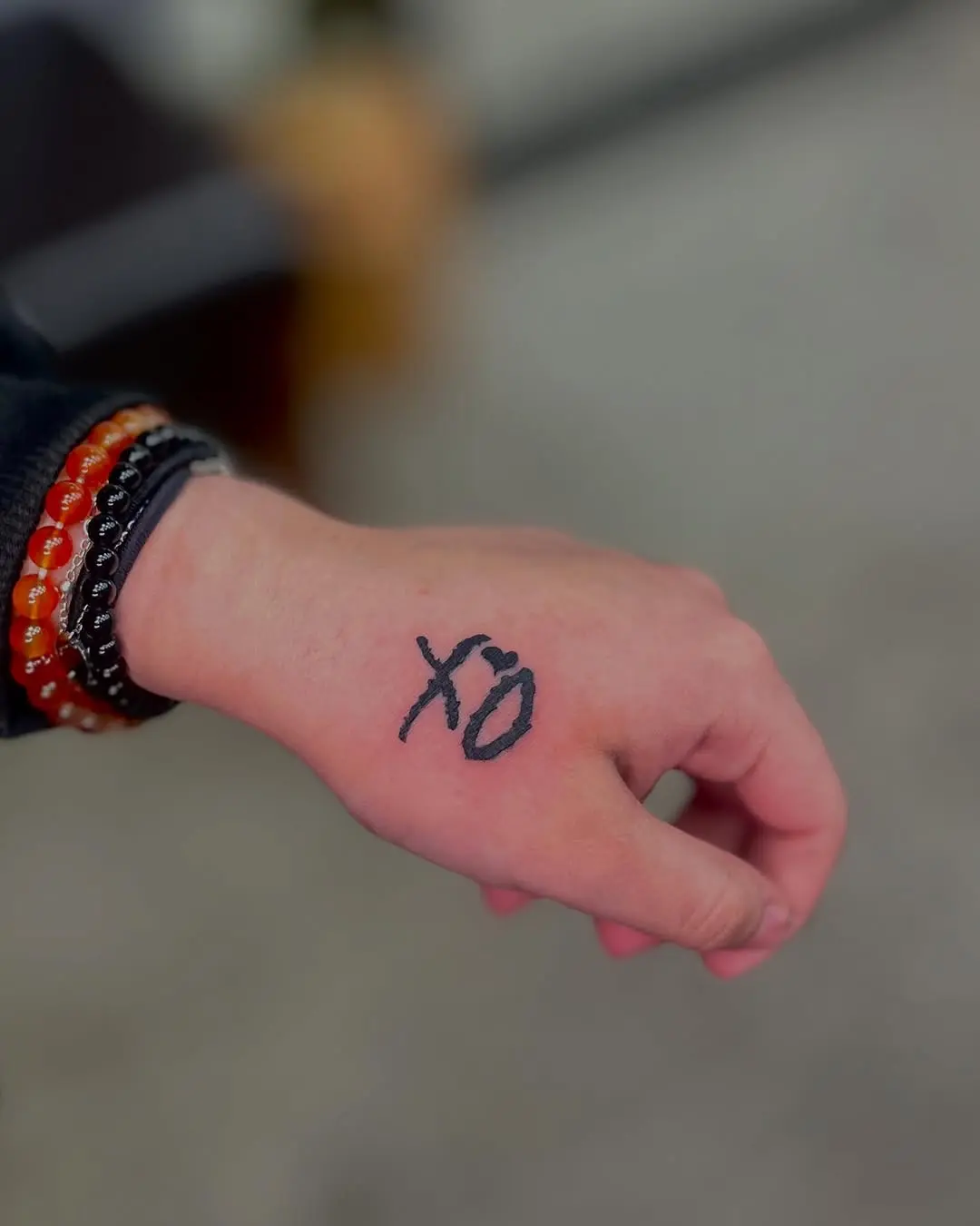 Chic XO Hand Tattoo in Black Ink
