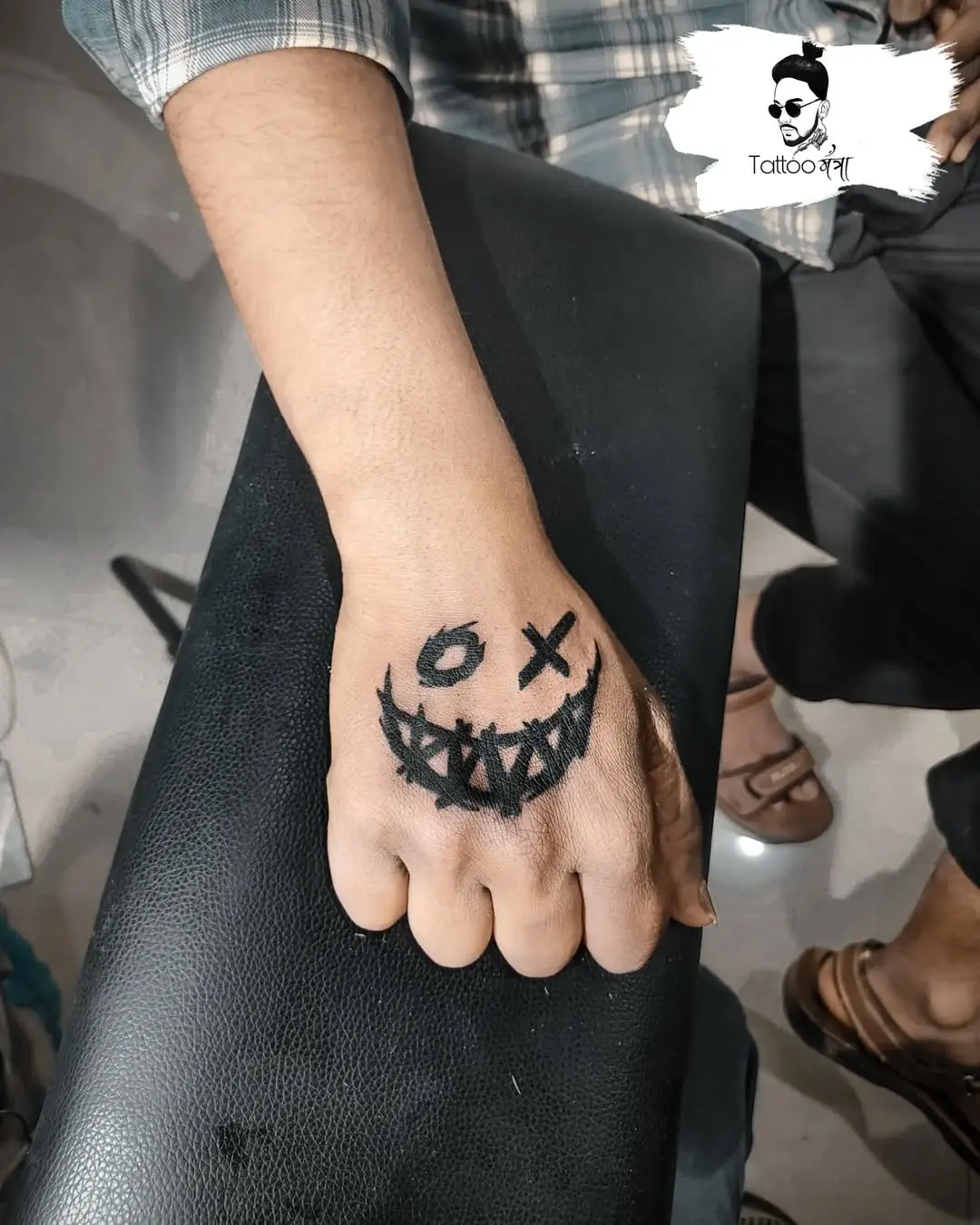 Bold XO Tattoo on a Hand