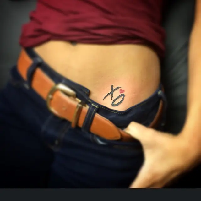 Stylish XO Tattoo on the Side of the Waist