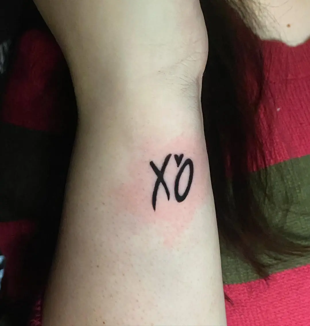 Minimalist XO Tattoo on the Forearm