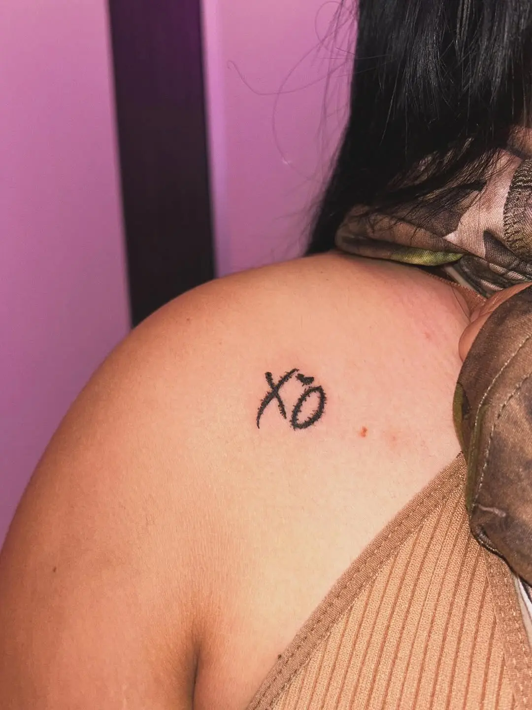 Minimalist XO Tattoo on the Back