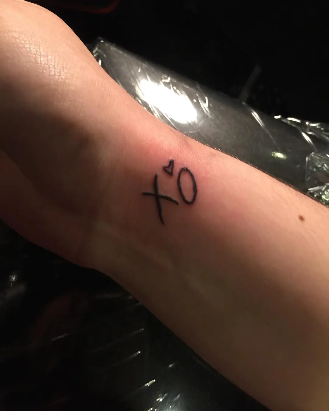 Minimalist XO Tattoo on Wrist