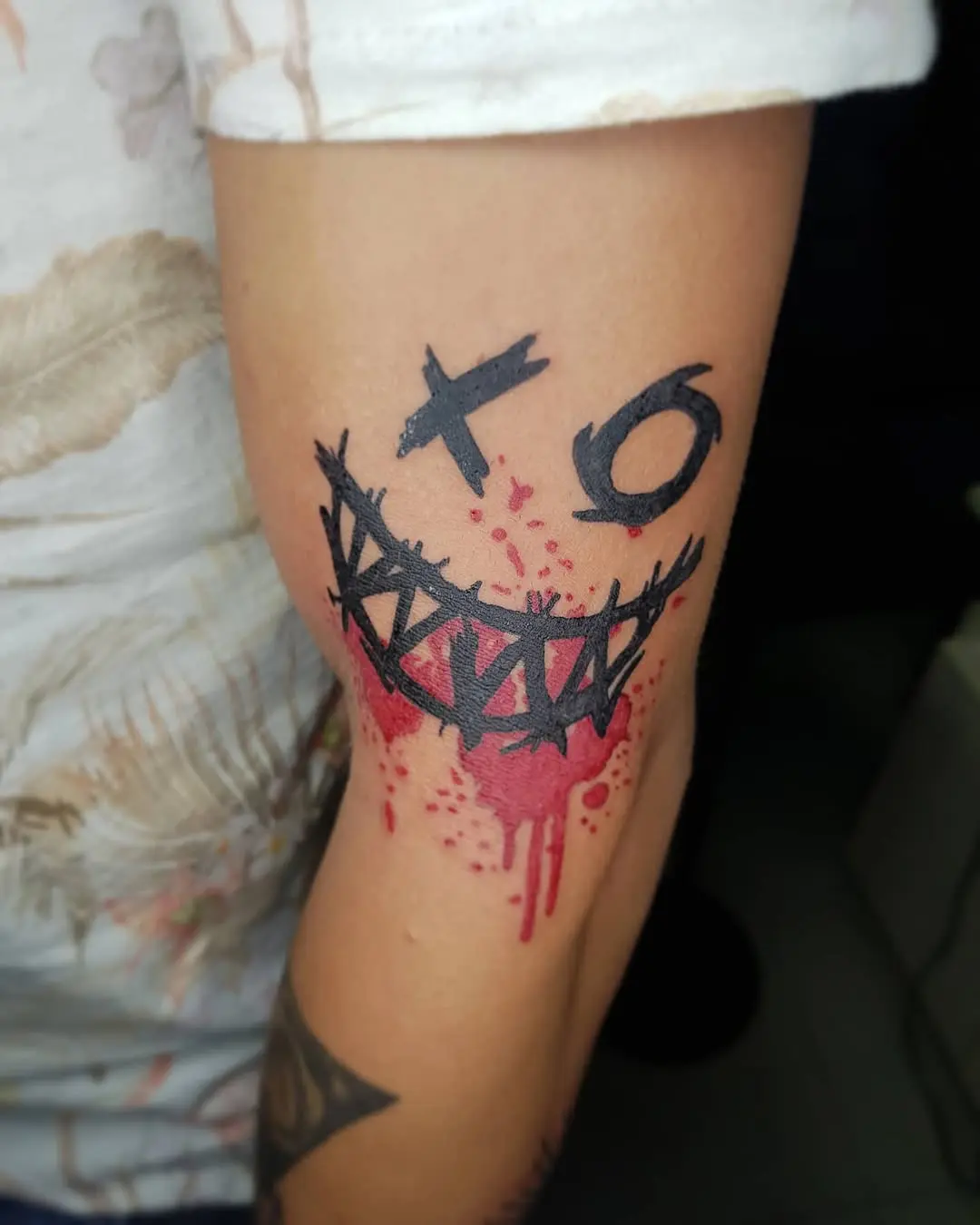 Bold XO Tattoo with a Playful Vibe