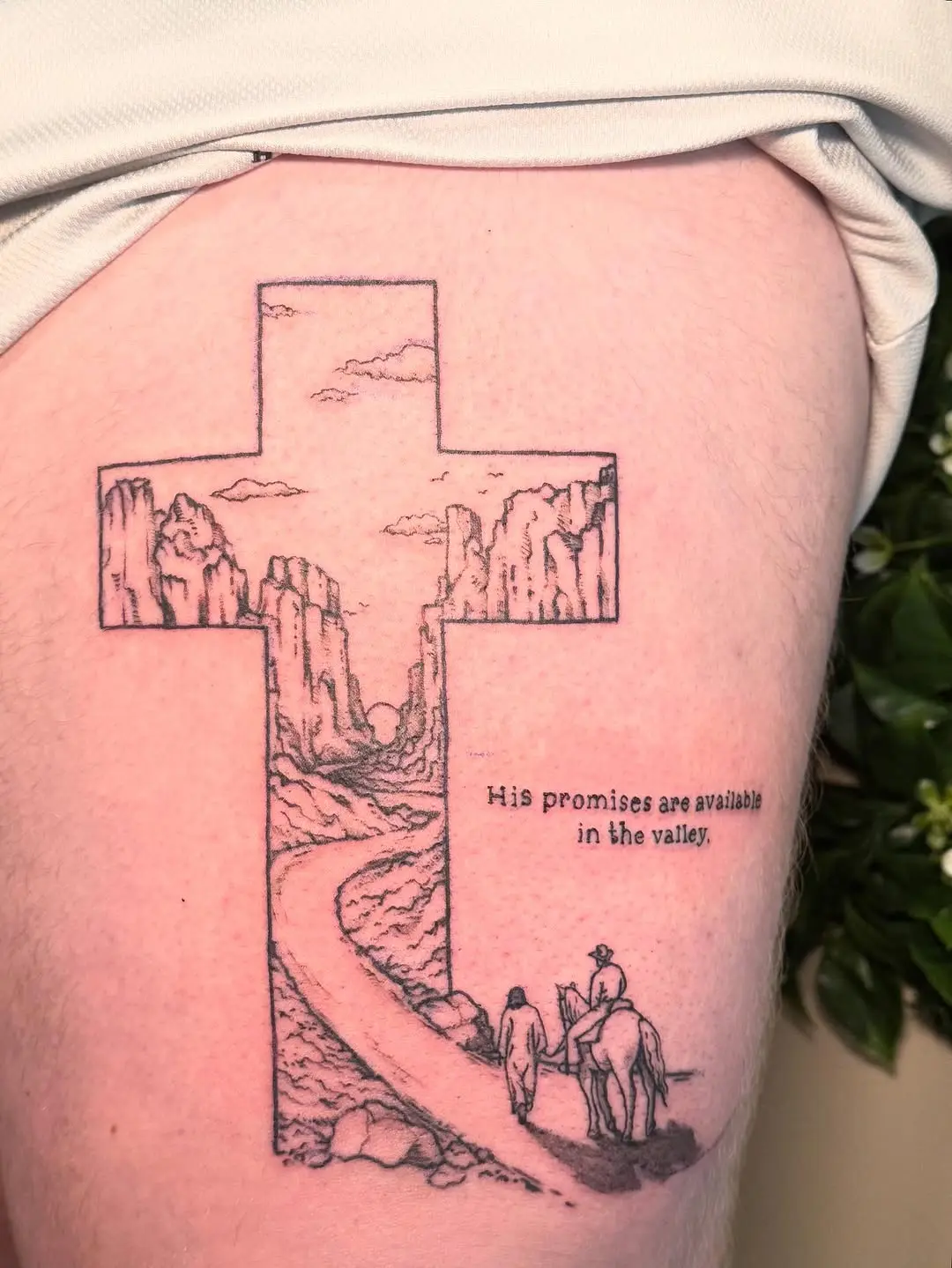 A Serene Cross Tattoo with a Scenic Journey