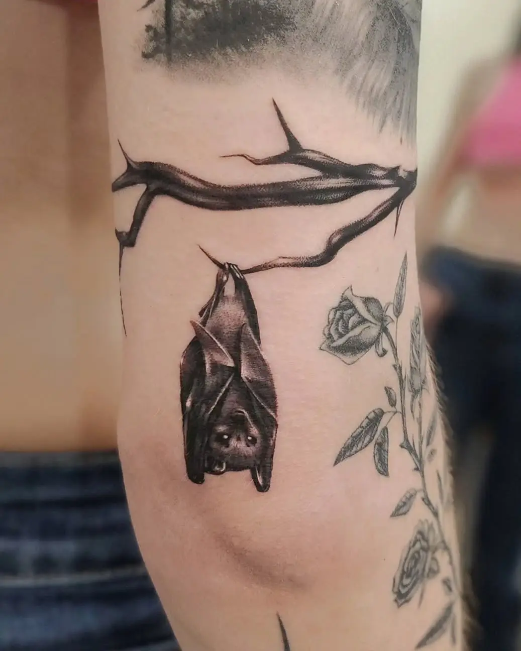 Stunning Bat Hanging from a Branch Tattoo