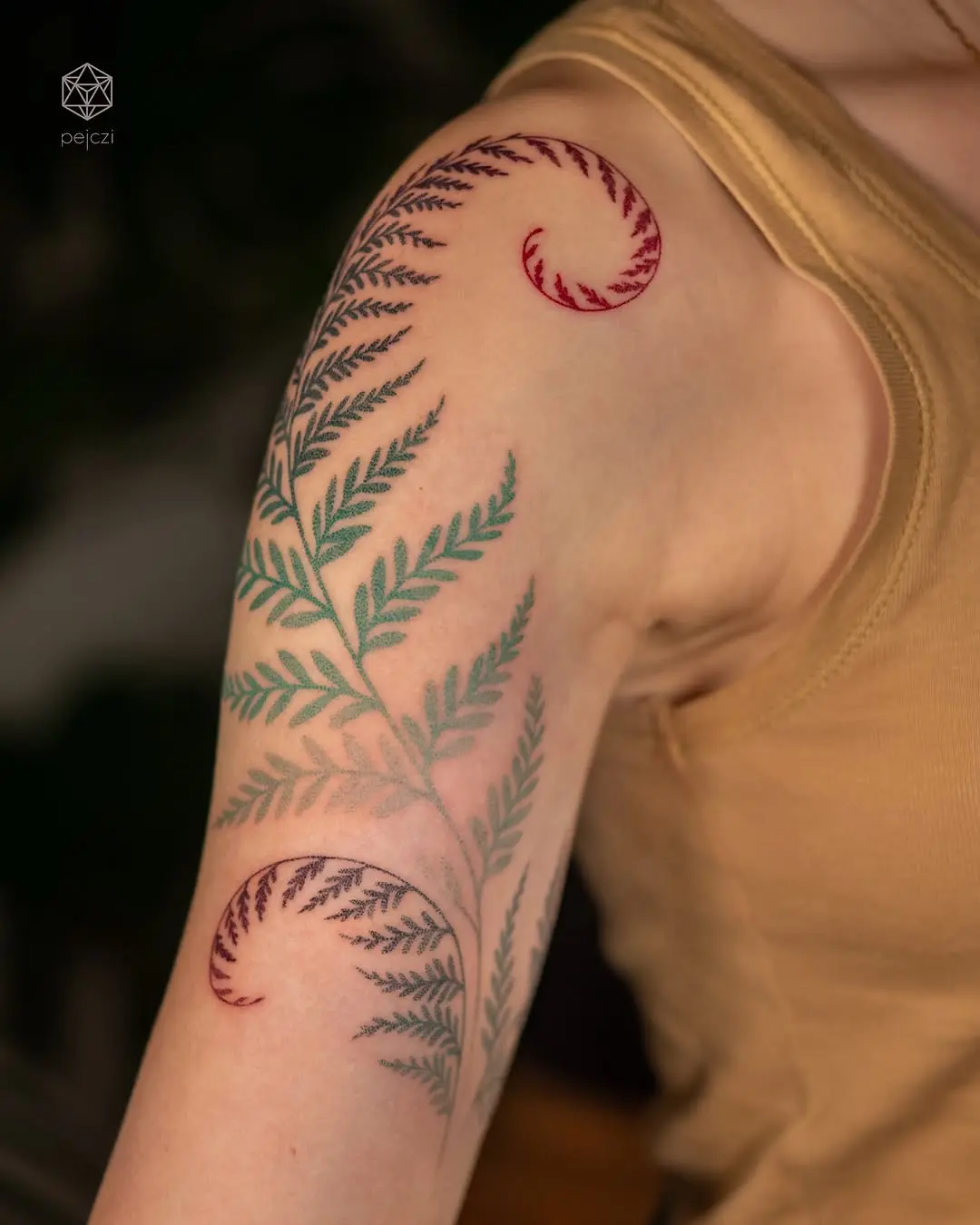 Elegant fern leaf tattoo with vibrant colors