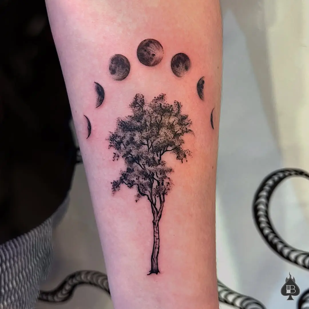 Symbolic birch tree with moon phases tattoo