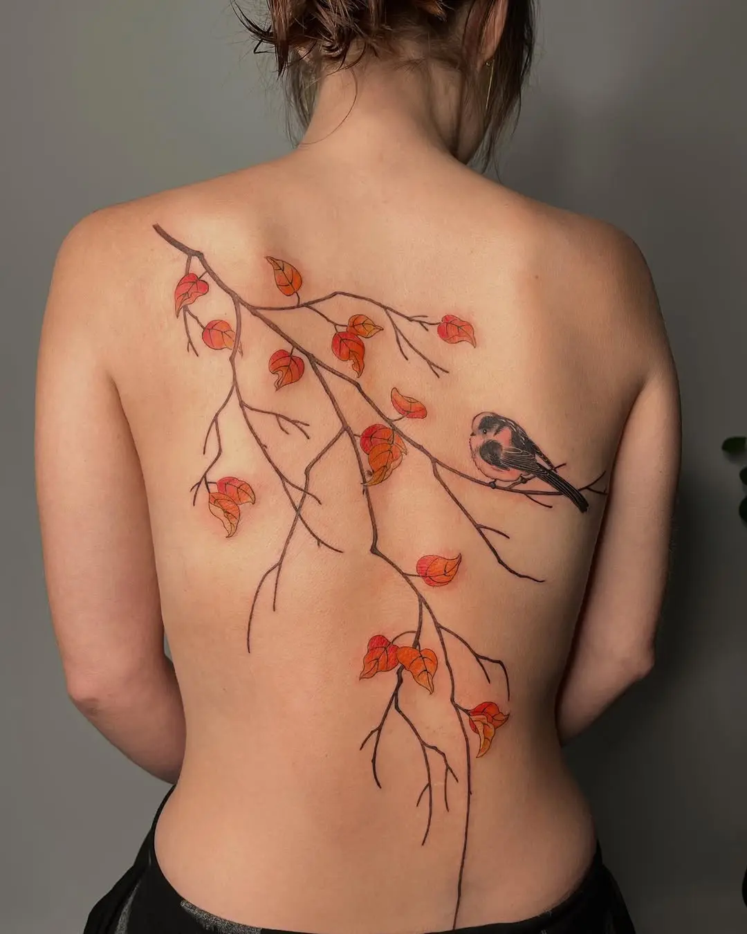 Elegant birch tree tattoo with a bird