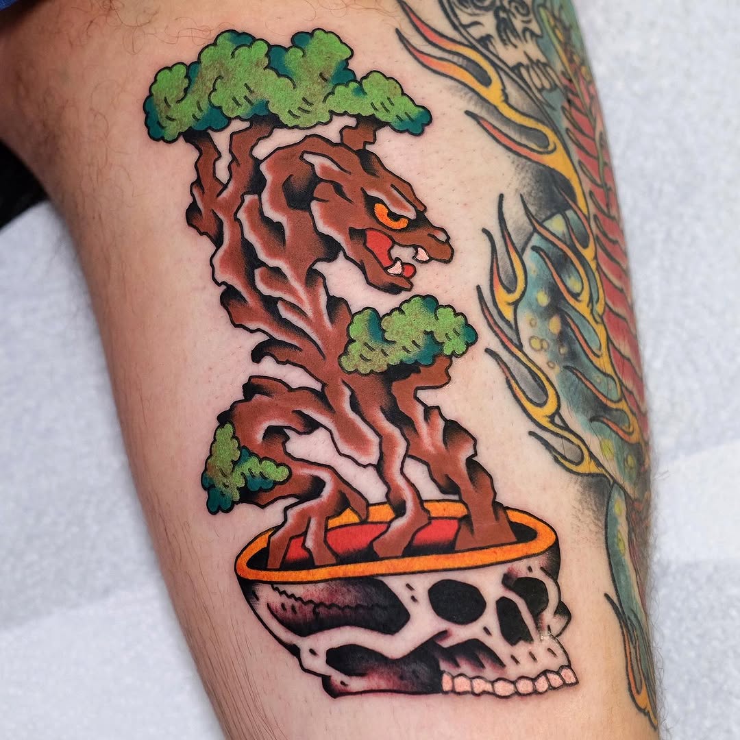 Striking bonsai tree with skull base tattoo