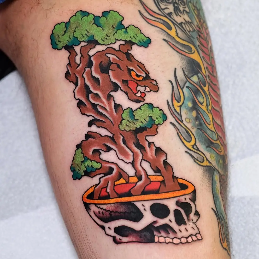 Striking bonsai tree with skull base tattoo