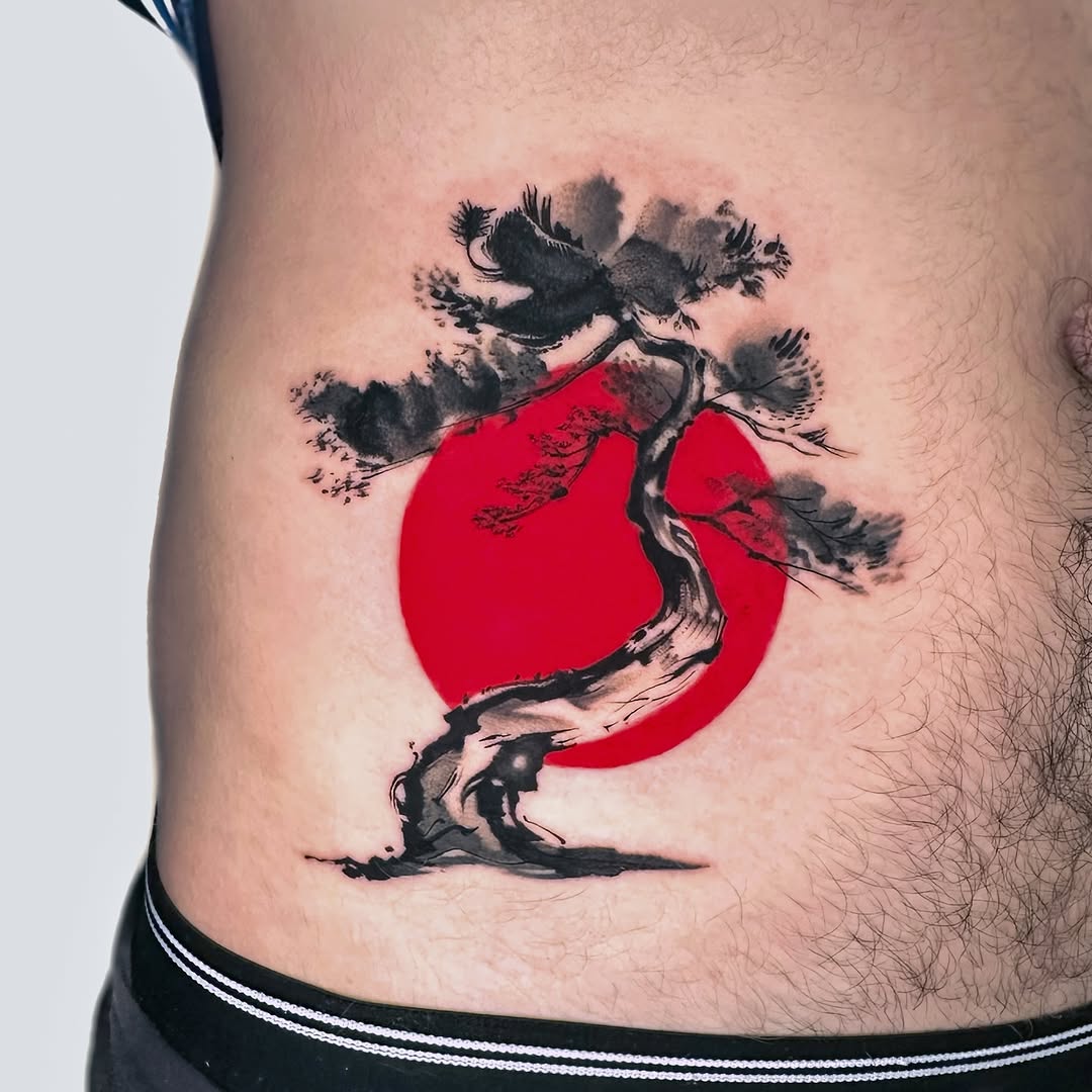 Artistic bonsai tattoo against a vibrant red sun