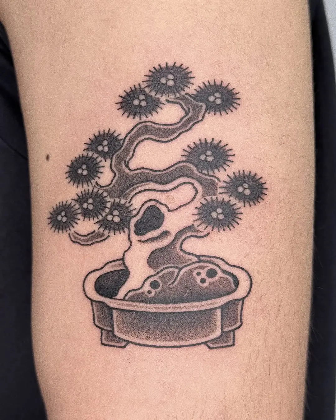 Elegant bonsai tattoo in detailed black ink