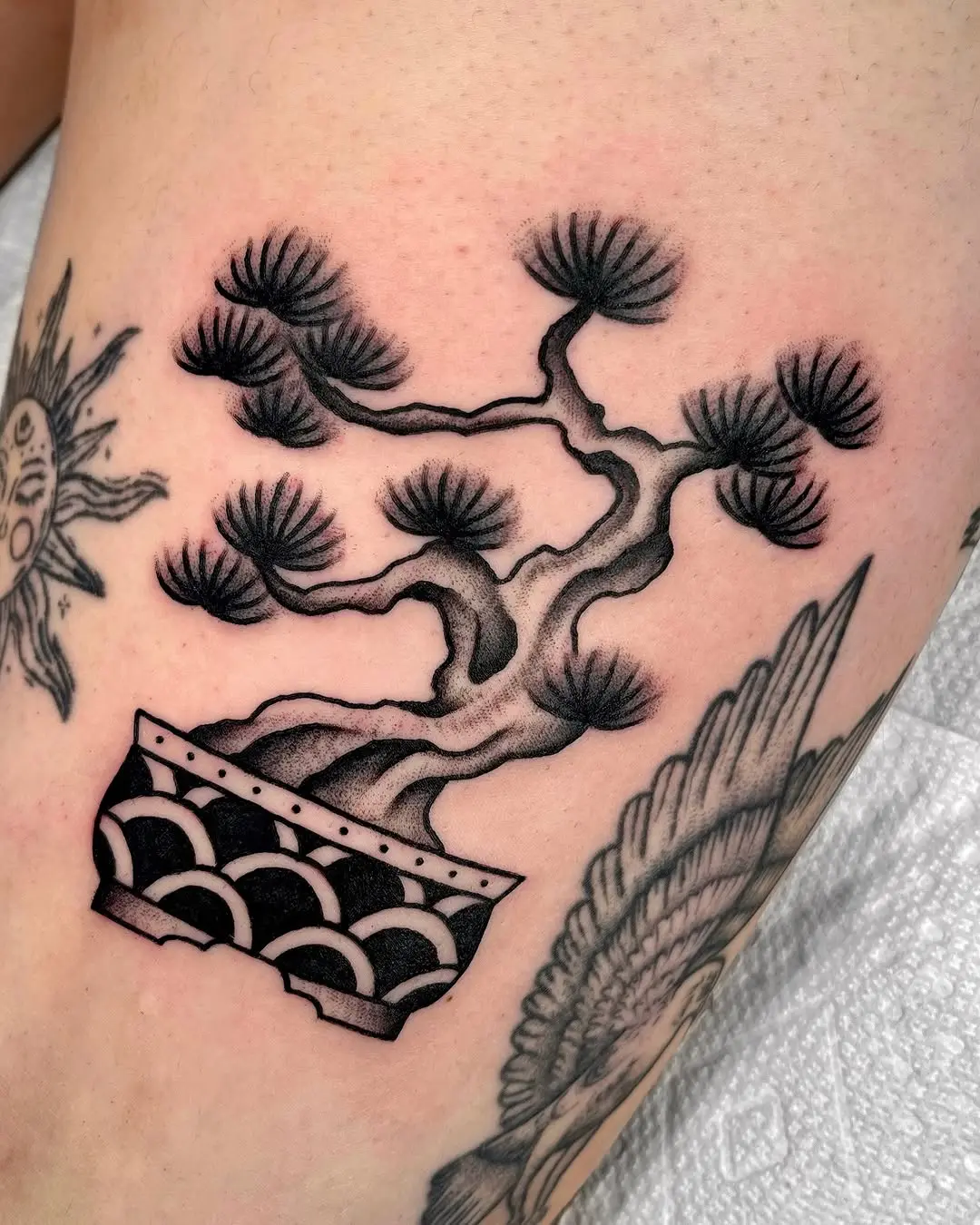 Detailed bonsai tattoo showcasing intricate artistry