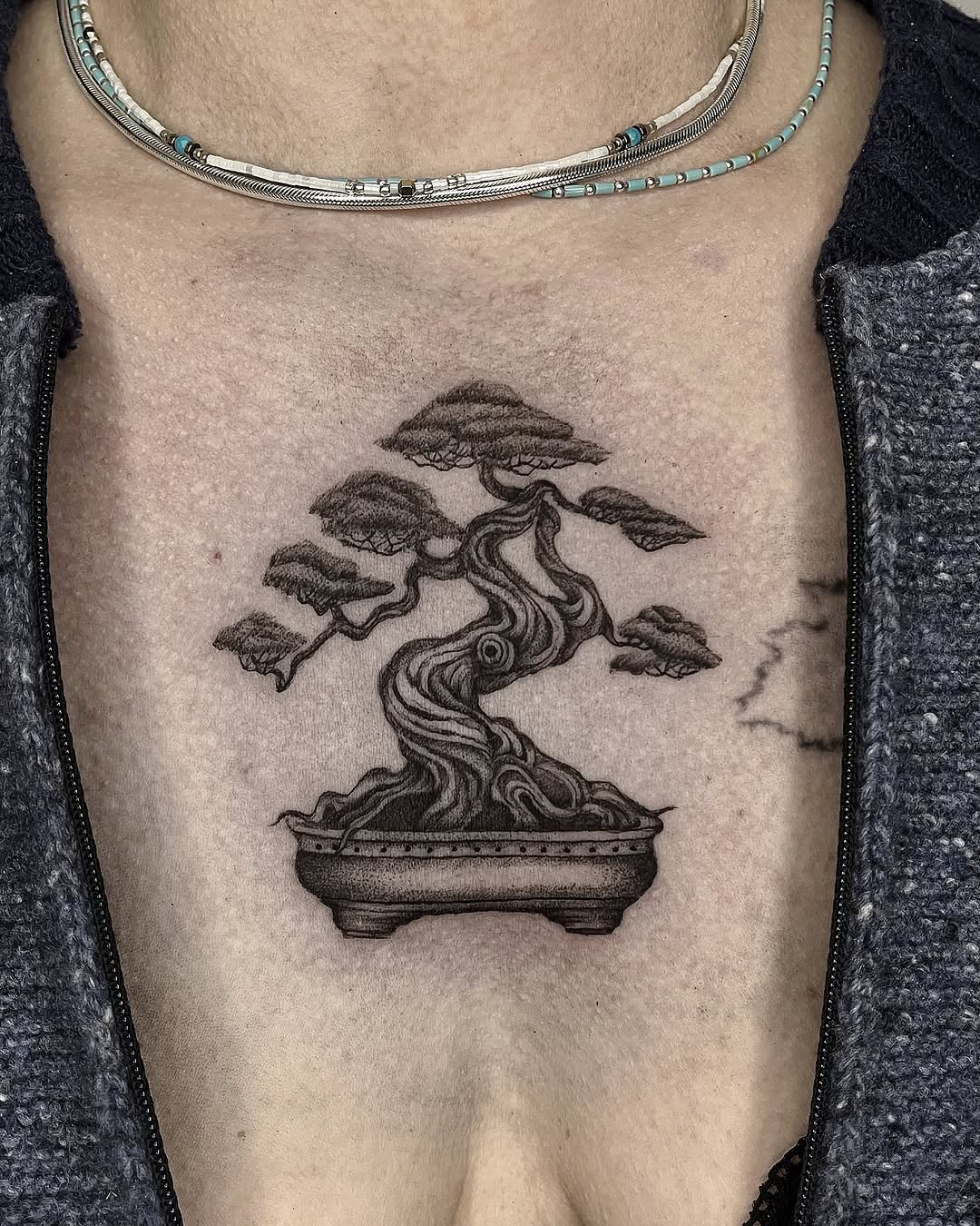 Elegant bonsai tattoo symbolizing tranquility and life.