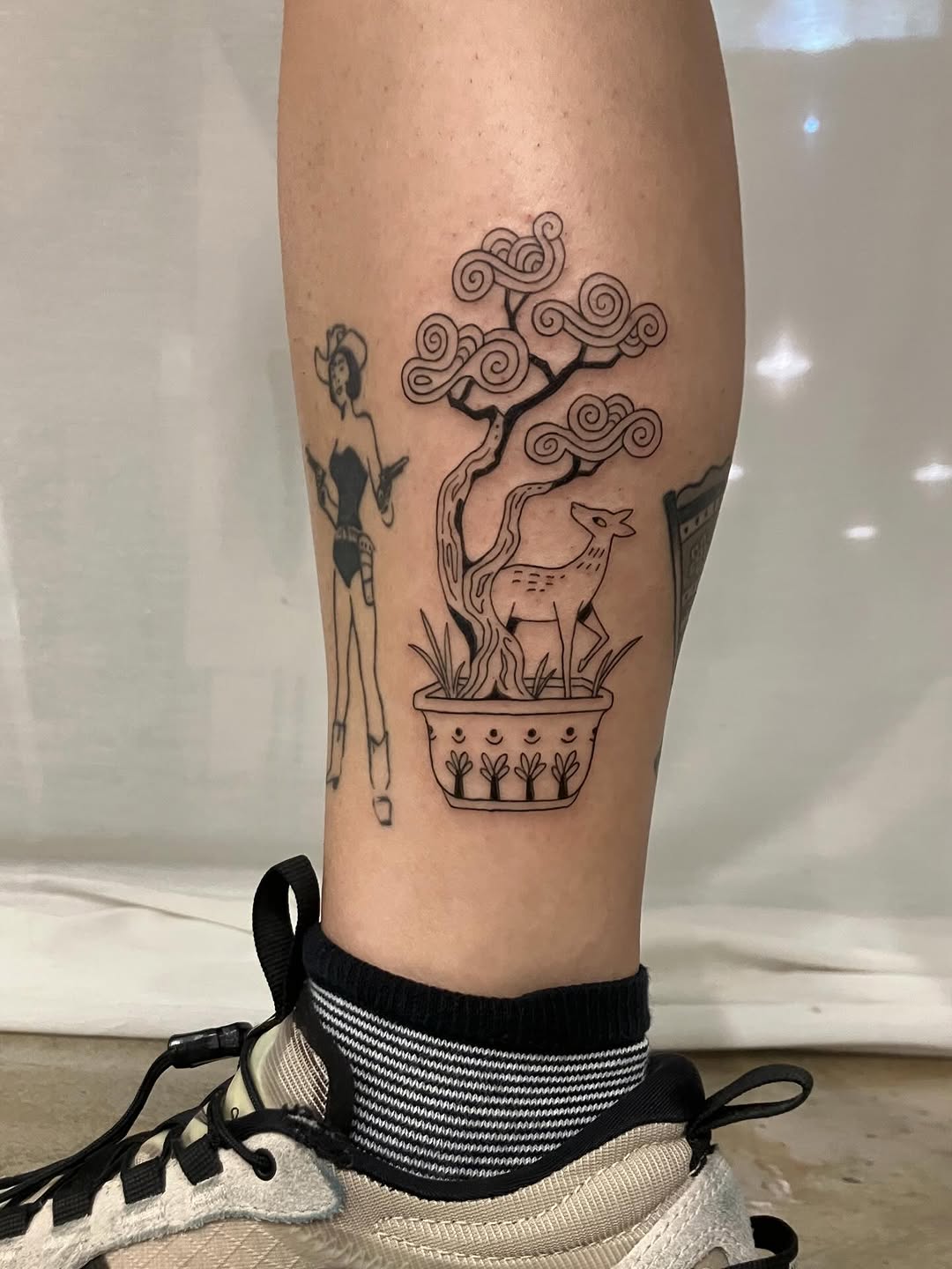 Unique bonsai tattoo with deer and figure