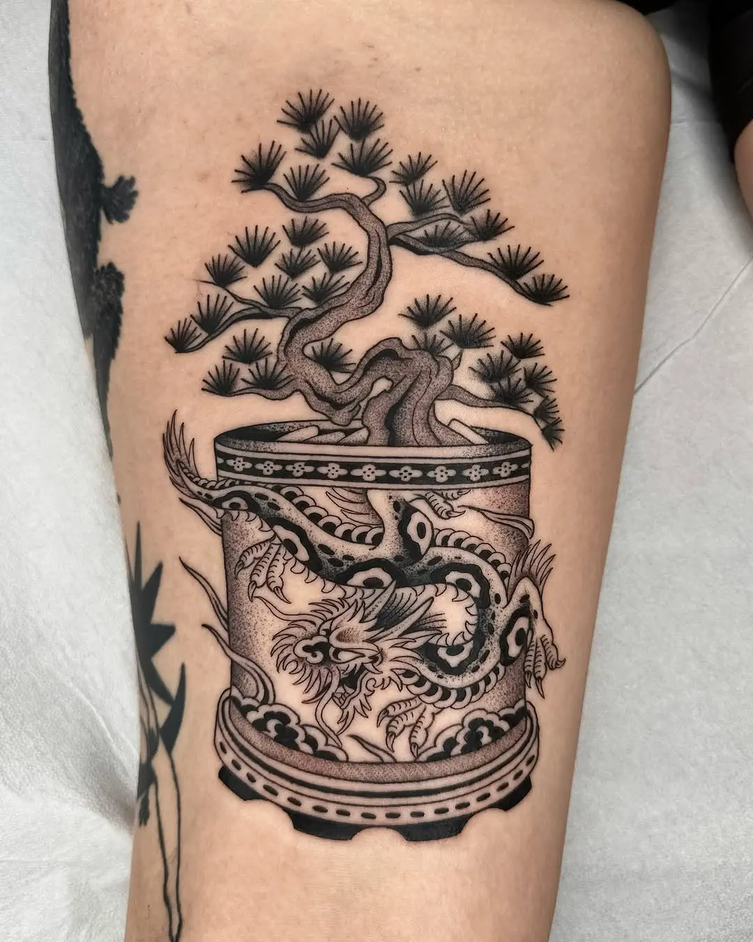 Elegant bonsai tattoo with dragon motif