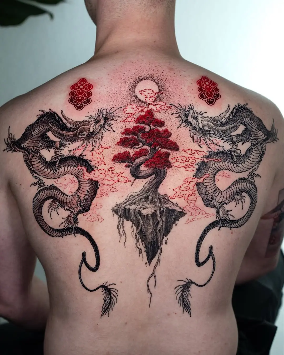 Stunning bonsai tattoo with dragon motifs